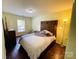 Bedroom featuring stylish decor, a large window and hardwood floors at 4698 Hannah Dr, Rock Hill, SC 29732