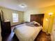 Bright bedroom featuring stylish decor, a large window and hardwood floors at 4698 Hannah Dr, Rock Hill, SC 29732