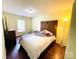 Comfortable bedroom with dark wood floors and natural light at 4698 Hannah Dr, Rock Hill, SC 29732