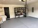 The spacious garage has painted floors, an overhead light, and shelving for storage at 4698 Hannah Dr, Rock Hill, SC 29732