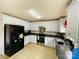 Bright kitchen featuring white cabinetry, dark countertops, and stainless steel appliances at 4698 Hannah Dr, Rock Hill, SC 29732