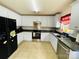 Bright kitchen featuring white cabinetry, dark countertops, and stainless steel appliances at 4698 Hannah Dr, Rock Hill, SC 29732