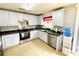 Updated kitchen featuring stainless steel appliances, white cabinets, and tile flooring at 4698 Hannah Dr, Rock Hill, SC 29732