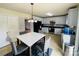 Open kitchen features white cabinets, modern appliances, and an adjacent dining area at 4698 Hannah Dr, Rock Hill, SC 29732