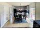 Open kitchen features white cabinets, modern appliances, and an adjacent dining area with sliding glass doors at 4698 Hannah Dr, Rock Hill, SC 29732