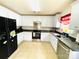 Updated kitchen featuring stainless steel appliances, white cabinets, and tile flooring at 4698 Hannah Dr, Rock Hill, SC 29732