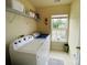 Laundry room with large washer, dryer and window providing natural light at 4698 Hannah Dr, Rock Hill, SC 29732