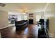 Spacious living room with hardwood floors, fireplace, and open access to the kitchen at 4698 Hannah Dr, Rock Hill, SC 29732