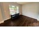 Bright living area with hardwood floors and a table beneath a large window at 4698 Hannah Dr, Rock Hill, SC 29732