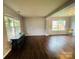 Open living area featuring hardwood floors and lots of natural light from large windows at 4698 Hannah Dr, Rock Hill, SC 29732