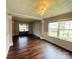 Elegant living room featuring hardwood floors, large windows, and detailed ceiling design at 4698 Hannah Dr, Rock Hill, SC 29732