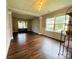 Elegant living room with hardwood floors, decorative ceiling, and large windows at 4698 Hannah Dr, Rock Hill, SC 29732