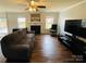 Bright living room showcasing a fireplace, large windows, and comfortable seating at 4698 Hannah Dr, Rock Hill, SC 29732
