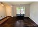 Inviting living room with dark wood floors, neutral walls, and plenty of natural light at 4698 Hannah Dr, Rock Hill, SC 29732