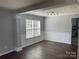 Inviting living room with beautiful wood floors, wainscoting detail, and large windows for natural light at 4698 Hannah Dr, Rock Hill, SC 29732