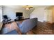Inviting living room with hardwood floors, ceiling fan, and stairs leading to the upper level at 4698 Hannah Dr, Rock Hill, SC 29732