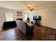 Spacious living room with hardwood floors, a ceiling fan, and a cozy fireplace at 4698 Hannah Dr, Rock Hill, SC 29732