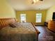 Spacious main bedroom with a ceiling fan, two windows and wooden furniture at 4698 Hannah Dr, Rock Hill, SC 29732