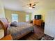 Bright main bedroom features wood floors, windows and a large dresser at 4698 Hannah Dr, Rock Hill, SC 29732