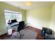 Well-lit office with rolling desk chair and neutral paint at 4698 Hannah Dr, Rock Hill, SC 29732