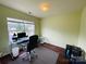 Comfortable office with large window, computer workstation and wood-style floors at 4698 Hannah Dr, Rock Hill, SC 29732