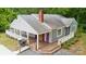 Charming home featuring a deck, a purple front door, and manicured landscaping at 500 Peigler Nw St, Concord, NC 28027