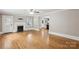 Open living room boasting hardwood floors, a decorative fireplace, and multiple entryways at 500 Peigler Nw St, Concord, NC 28027
