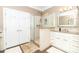 Modern bathroom with glass-enclosed shower, sleek white cabinetry, and luxurious granite countertop at 532 Wilmslow Rd, Rock Hill, SC 29730