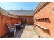 A private brick courtyard features stone ground cover, seating, and a built in wooden bench at 532 Wilmslow Rd, Rock Hill, SC 29730