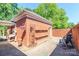 Private courtyard with custom wooden bench, potted plants, and a seating area for relaxation at 532 Wilmslow Rd, Rock Hill, SC 29730