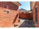 Charming courtyard with brick walls, stone ground cover, and potted plants adding beauty to the outdoor space at 532 Wilmslow Rd, Rock Hill, SC 29730