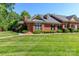 Charming brick home featuring a manicured lawn, mature landscaping, and inviting curb appeal at 532 Wilmslow Rd, Rock Hill, SC 29730