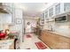 Bright kitchen featuring granite countertops, stainless appliances, and adjacent breakfast nook with door to a small patio at 532 Wilmslow Rd, Rock Hill, SC 29730