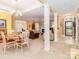 Open-concept living space featuring a fireplace, dining area, and access to front entry at 532 Wilmslow Rd, Rock Hill, SC 29730
