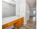 Bathroom featuring a vanity with marble countertop, wooden cabinets, and hardwood floors at 5833 Harris Grove Ln, Charlotte, NC 28212