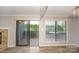 Dining area with sliding doors to a balcony and a view into the kitchen area at 5833 Harris Grove Ln, Charlotte, NC 28212
