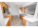 Kitchen features wooden cabinets, stainless steel appliances, and hardwood floors at 5833 Harris Grove Ln, Charlotte, NC 28212