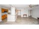 Living room and kitchen area with hardwood floors, a ceiling fan, and neutral paint at 5833 Harris Grove Ln, Charlotte, NC 28212