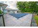 Closed in-ground pool with surrounding patio space, adjacent to clubhouse, perfect for community enjoyment at 5833 Harris Grove Ln, Charlotte, NC 28212