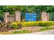 Community entrance with 'Harris Lake' signage, complemented by well-maintained landscaping at 5833 Harris Grove Ln, Charlotte, NC 28212
