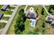 Aerial view of home with pool, patio, and manicured lawn nestled in a serene neighborhood at 6603 Havencrest Dr, Denver, NC 28037