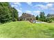 Spacious backyard with a lush green lawn and a refreshing pool, ideal for outdoor activities at 6603 Havencrest Dr, Denver, NC 28037