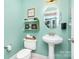 Cozy half-bathroom with unique decorative items, light green paint and modern sink at 6603 Havencrest Dr, Denver, NC 28037