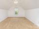 Bedroom with neutral paint, carpet, ceiling fan, and a view overlooking the backyard at 6603 Havencrest Dr, Denver, NC 28037