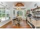 Breakfast nook features bay windows overlooking the backyard and decorative shelving at 6603 Havencrest Dr, Denver, NC 28037