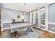 Elegant dining room with decorative rug, modern chandelier and plenty of natural light at 6603 Havencrest Dr, Denver, NC 28037