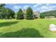 Well-manicured front yard featuring mature trees and lush greenery enhancing curb appeal at 6603 Havencrest Dr, Denver, NC 28037