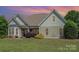Charming single-story home with well-manicured lawn and lush landscaping at 6603 Havencrest Dr, Denver, NC 28037