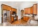Kitchen with wood cabinets, granite countertops, and stainless steel appliances at 6603 Havencrest Dr, Denver, NC 28037