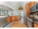Open concept kitchen boasts stainless appliances, wood cabinets and a breakfast nook at 6603 Havencrest Dr, Denver, NC 28037